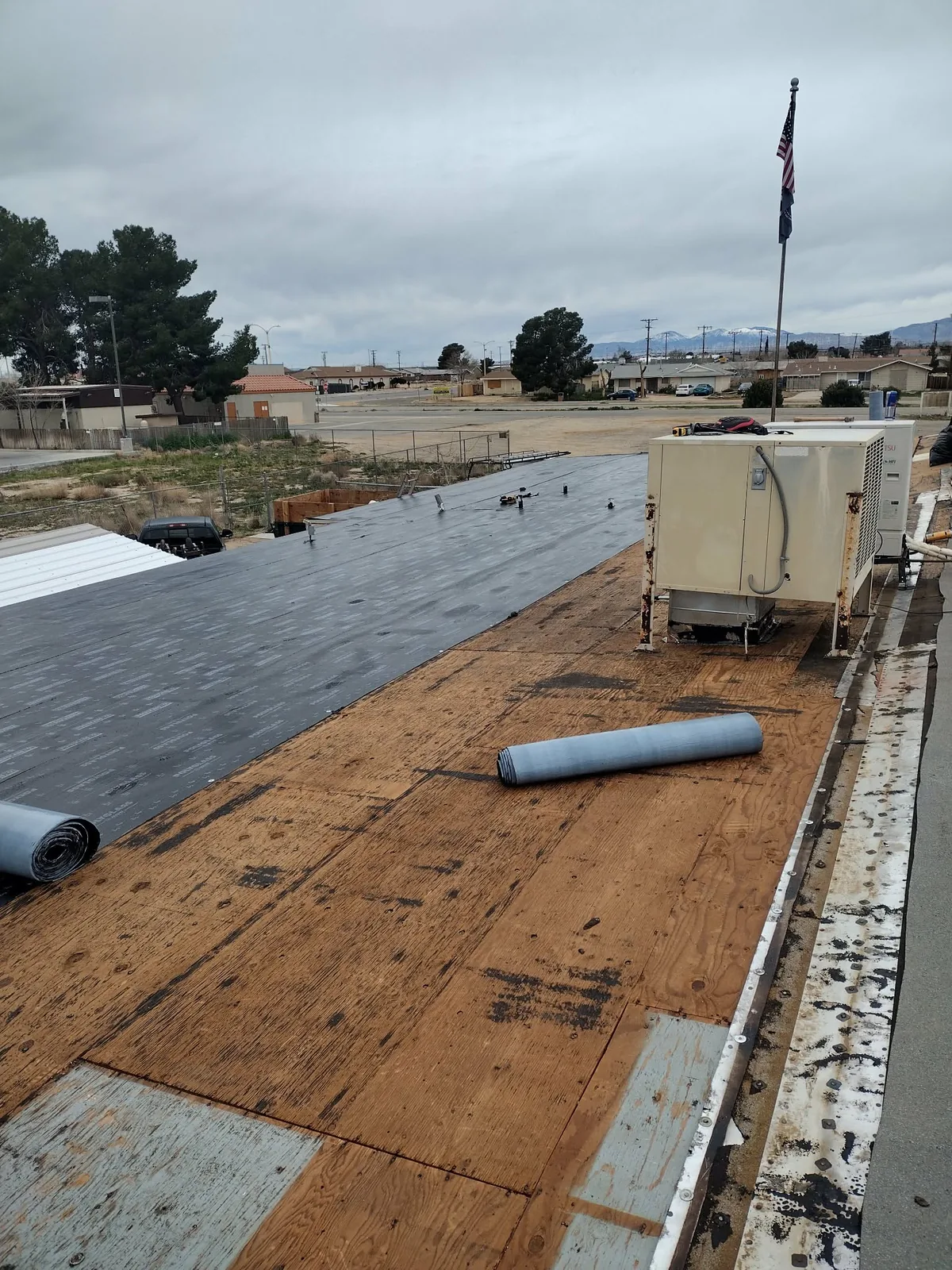 Flat-roof membrane installation in progress